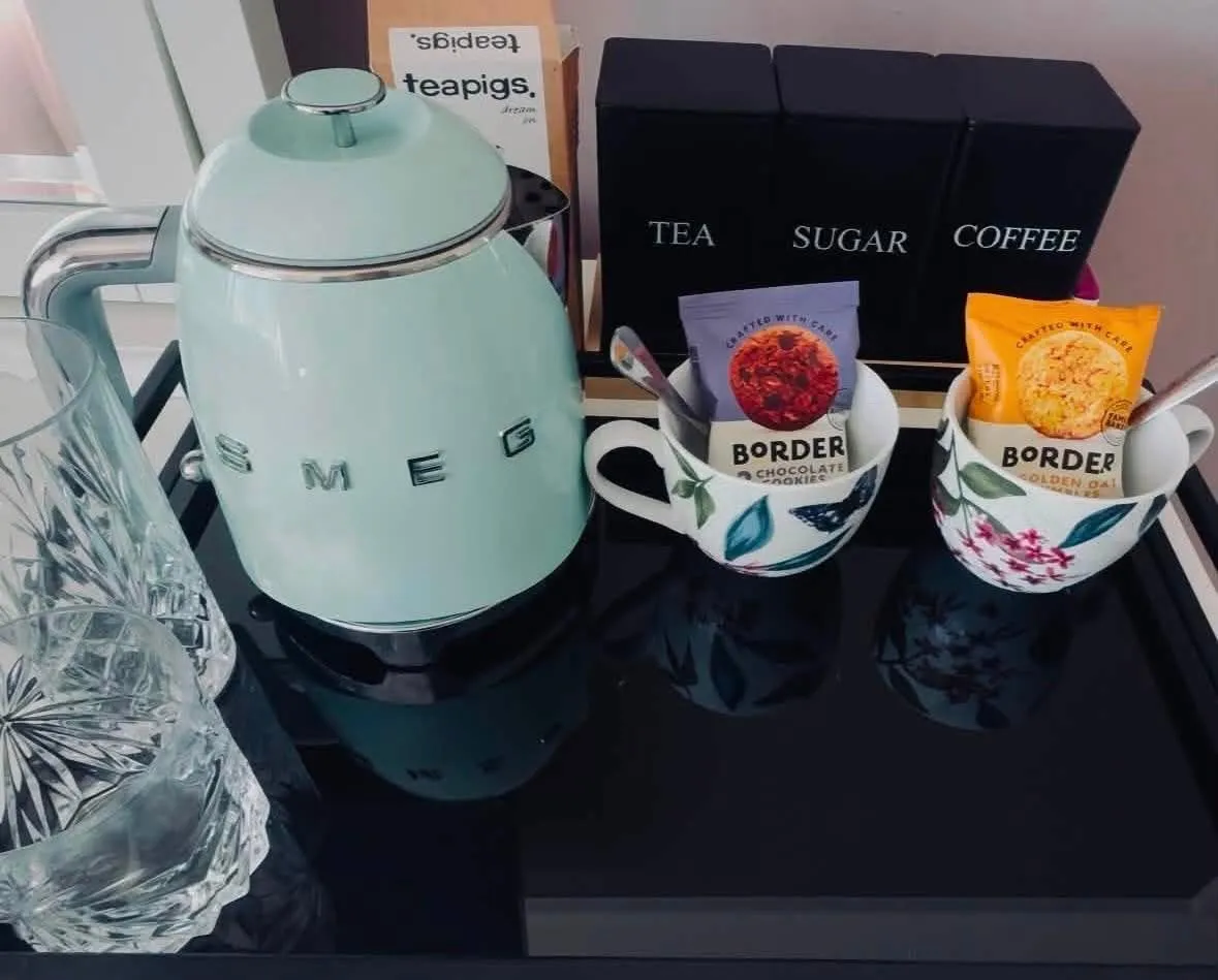 Neatly presented tea and coffee station, guest-ready